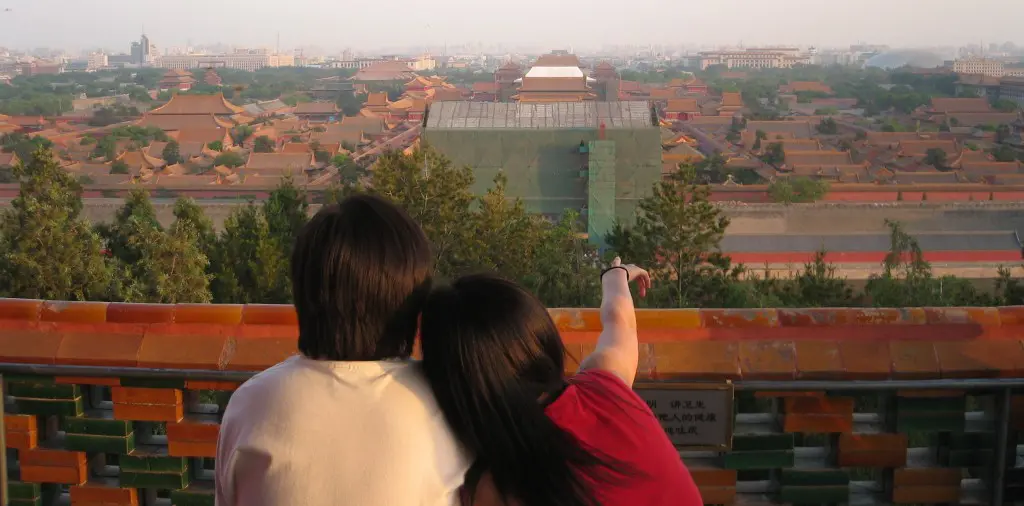 Couple sits overlooking Beijing 