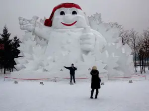 china harbin chinese tourists taking photo giant snowman