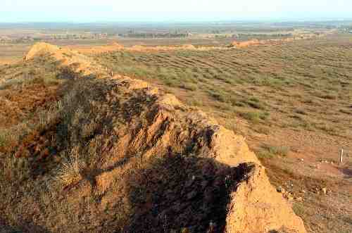 Old mounds representing the remains of parts of China's Great Wall