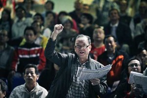 A man cheering during a horse race