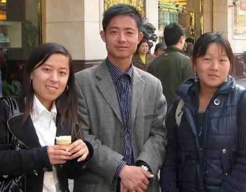 3 older looking college students who are actually Chinese scammers