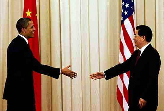 A leader of China and former American president, Barack Obama shaking hands