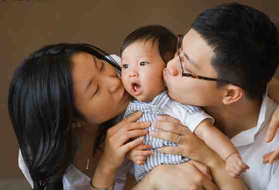 Chinese family holding baby 