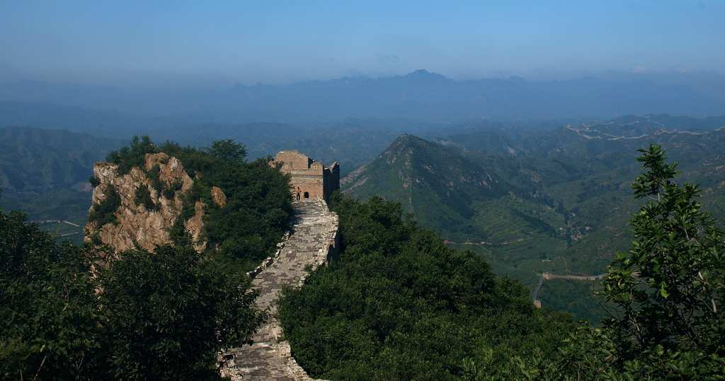 A view of the Great Wall with mountains in the background