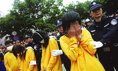 Prostitutes in China being paraded around for the purpose of shame