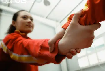 Grabbing the hand of a Chinese person