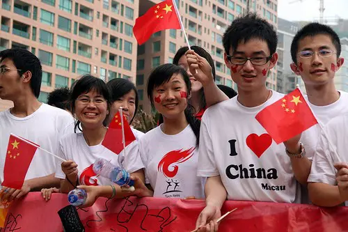 Chinese students wearing pro-China clothing and face paint