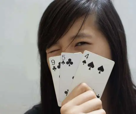 A Chinese woman playing poker