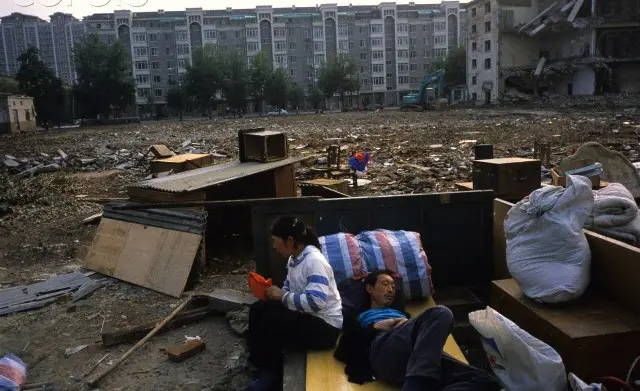 A rather sad picture, showing a homeless Chinese couple living on the streets