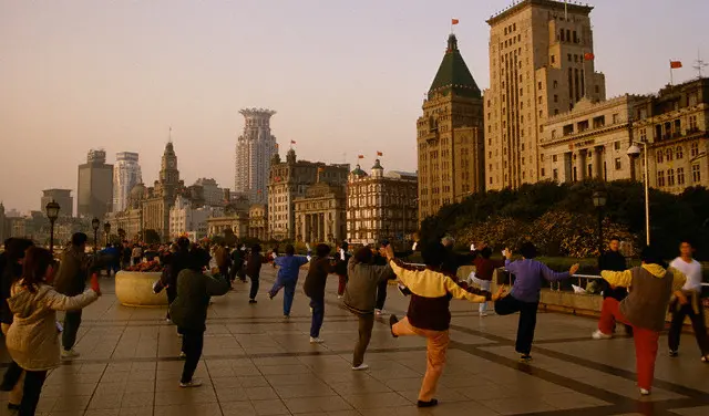 Elderly Chinese doing tai chi on the Bund in Shanghai, one view of health in China.