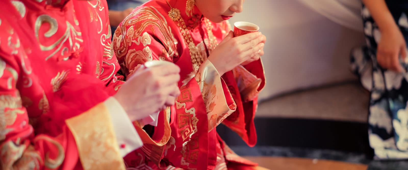 Chinese people during tea ceremony wearing the color red